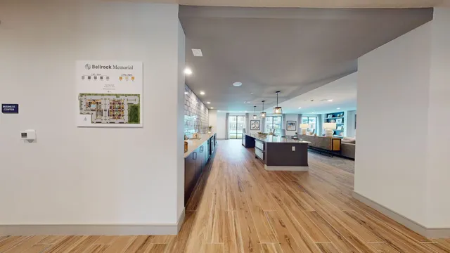 a view of a living room and kitchen with a large window