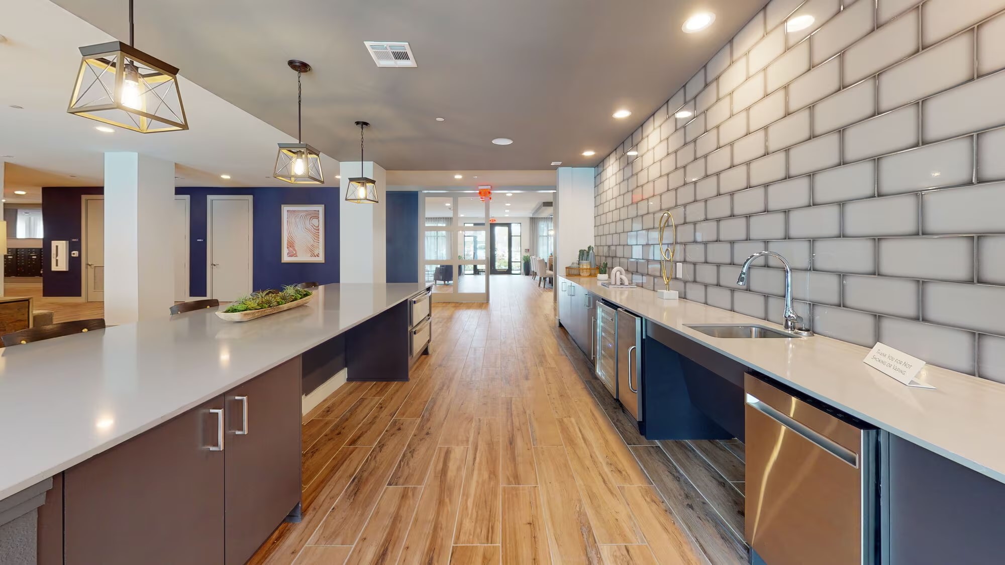 1148 Silber Road, Unit 8301 Houston, TX 77055 - Photo 34 of 36 a large kitchen with kitchen island a large counter space a sink a window and stainless steel appliances