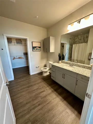 a bathroom with a double vanity sink and mirror