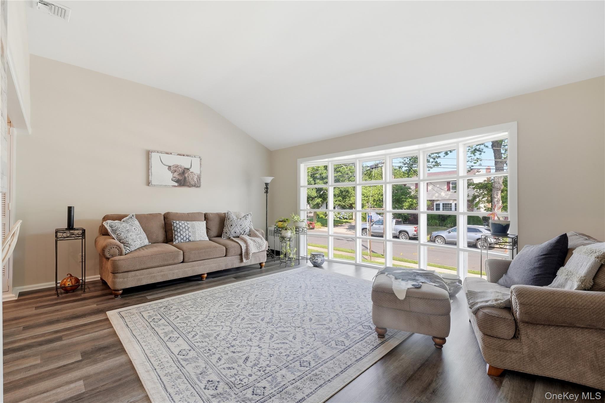 1853 Decatur Avenue Merrick, NY 11566 - Photo 5 of 43 a living room with furniture and a large window