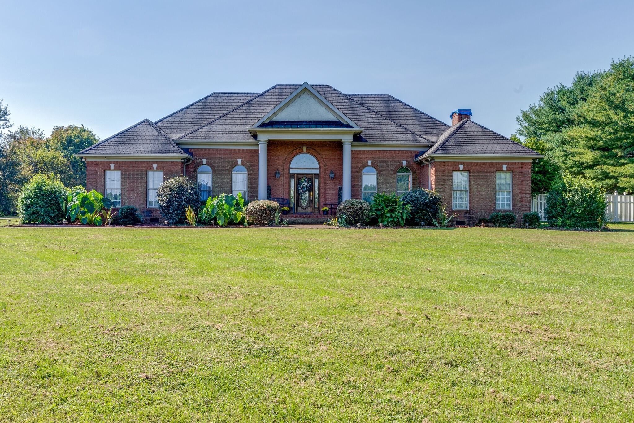 404 Denning Ford Road Portland, TN 37148 - Photo 1 of 30 a front view of a house with garden
