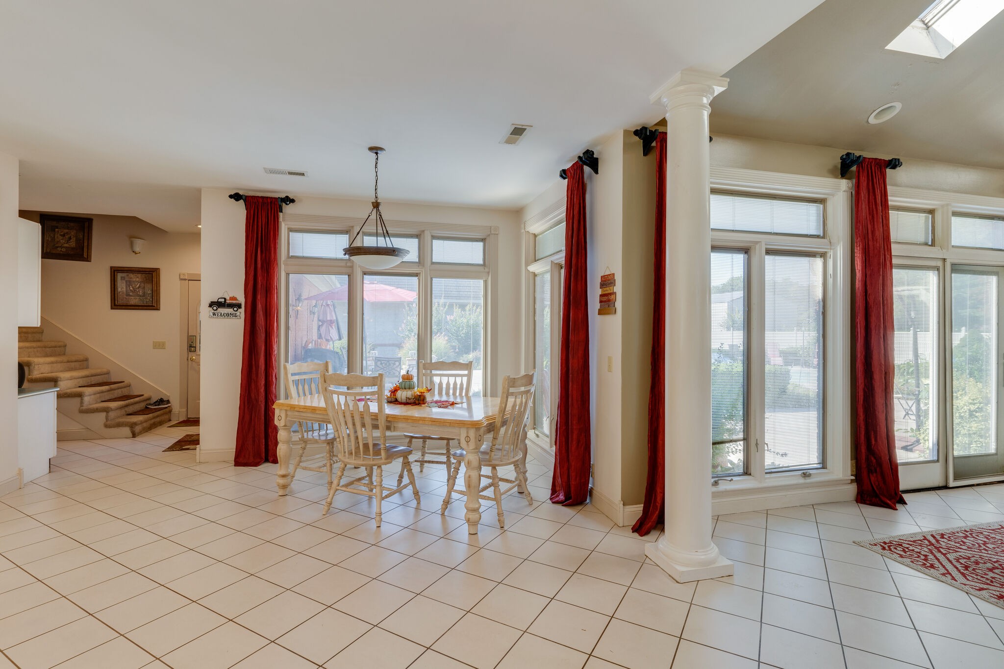 404 Denning Ford Road Portland, TN 37148 - Photo 15 of 30 a dining room with furniture and floor to ceiling windows