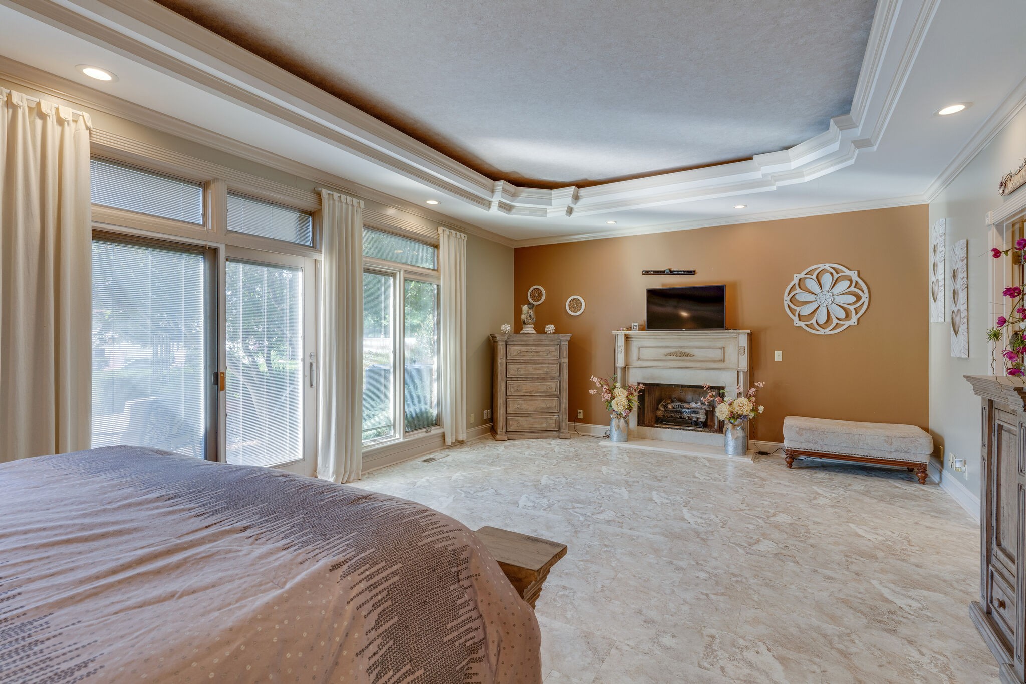 404 Denning Ford Road Portland, TN 37148 - Photo 17 of 30 a spacious bedroom with a bed and a chandelier