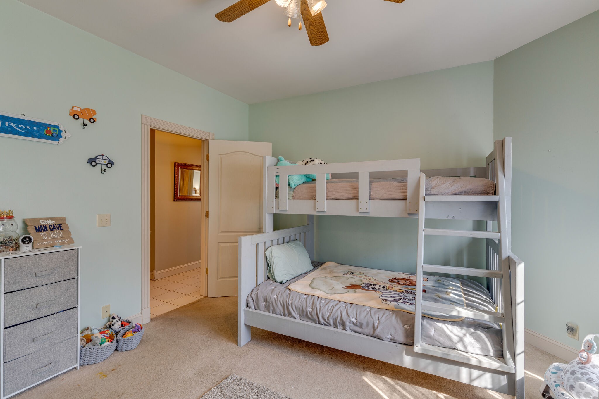 404 Denning Ford Road Portland, TN 37148 - Photo 24 of 30 a bedroom with a bed and ceiling fan