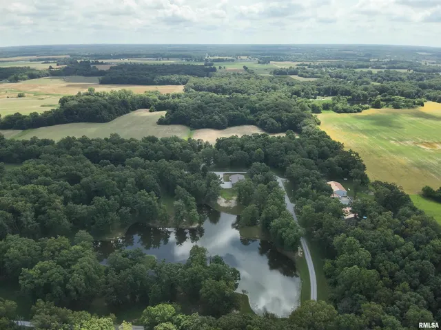 an aerial view of residential building and ocean