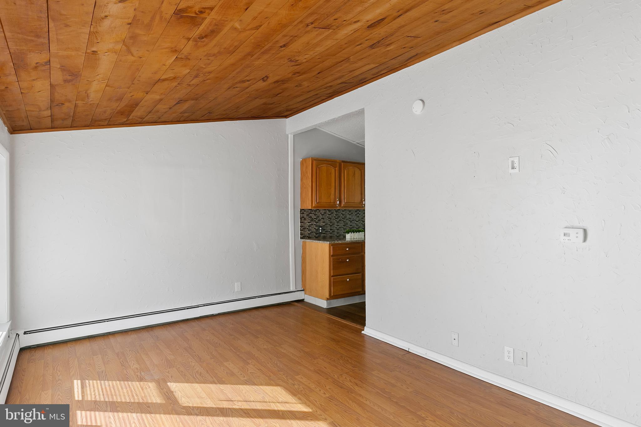 523 Estate Road Maple Shade, NJ 08052 - Photo 17 of 30 a view of empty room with wooden floor