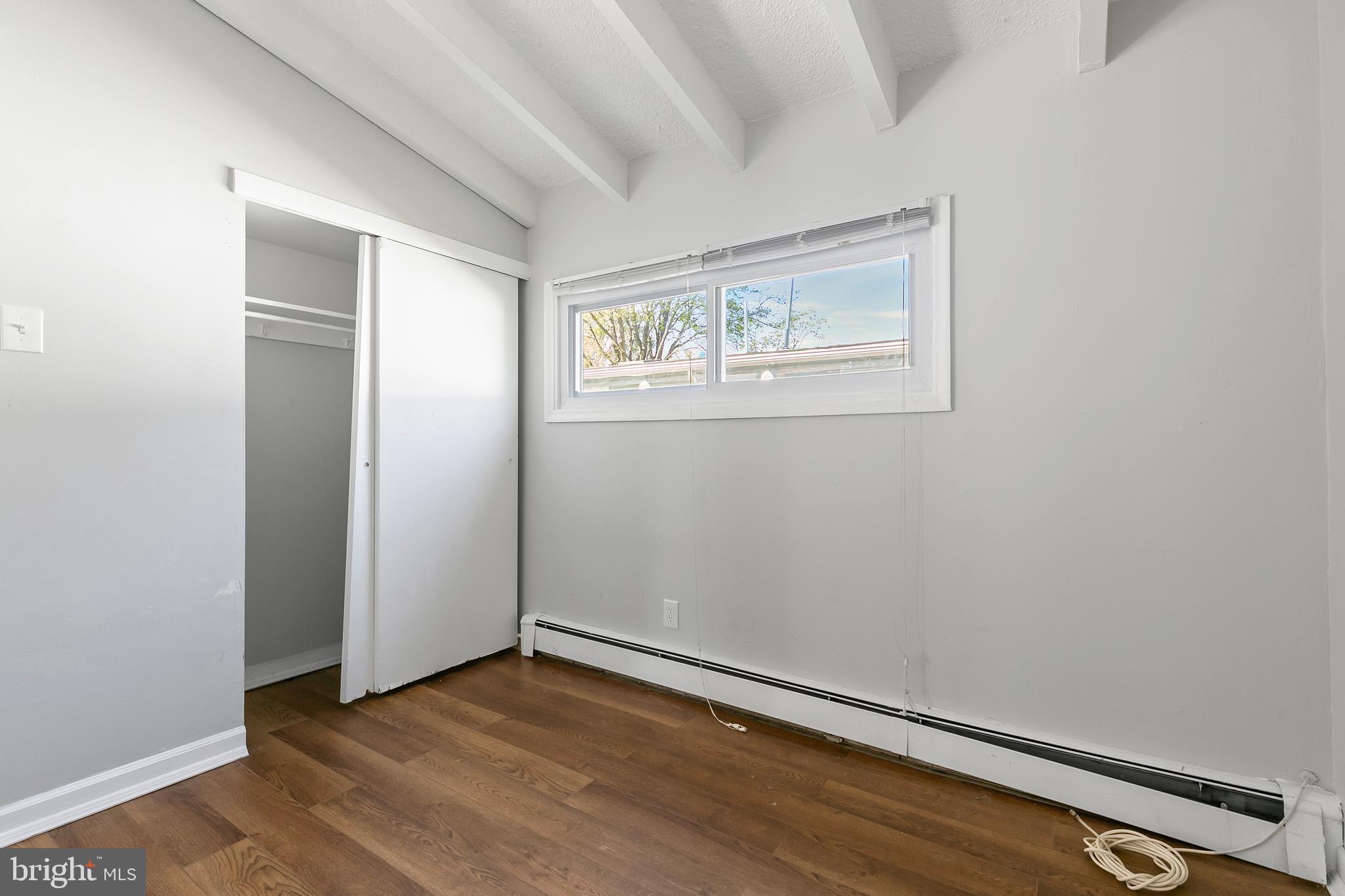 523 Estate Road Maple Shade, NJ 08052 - Photo 21 of 30 an empty room with wooden floor and closet