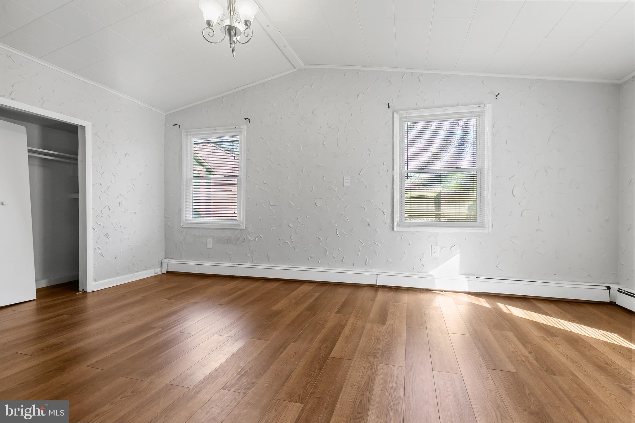 523 Estate Road Maple Shade, NJ 08052 - Photo 25 of 30 a view of an empty room with wooden floor and a window