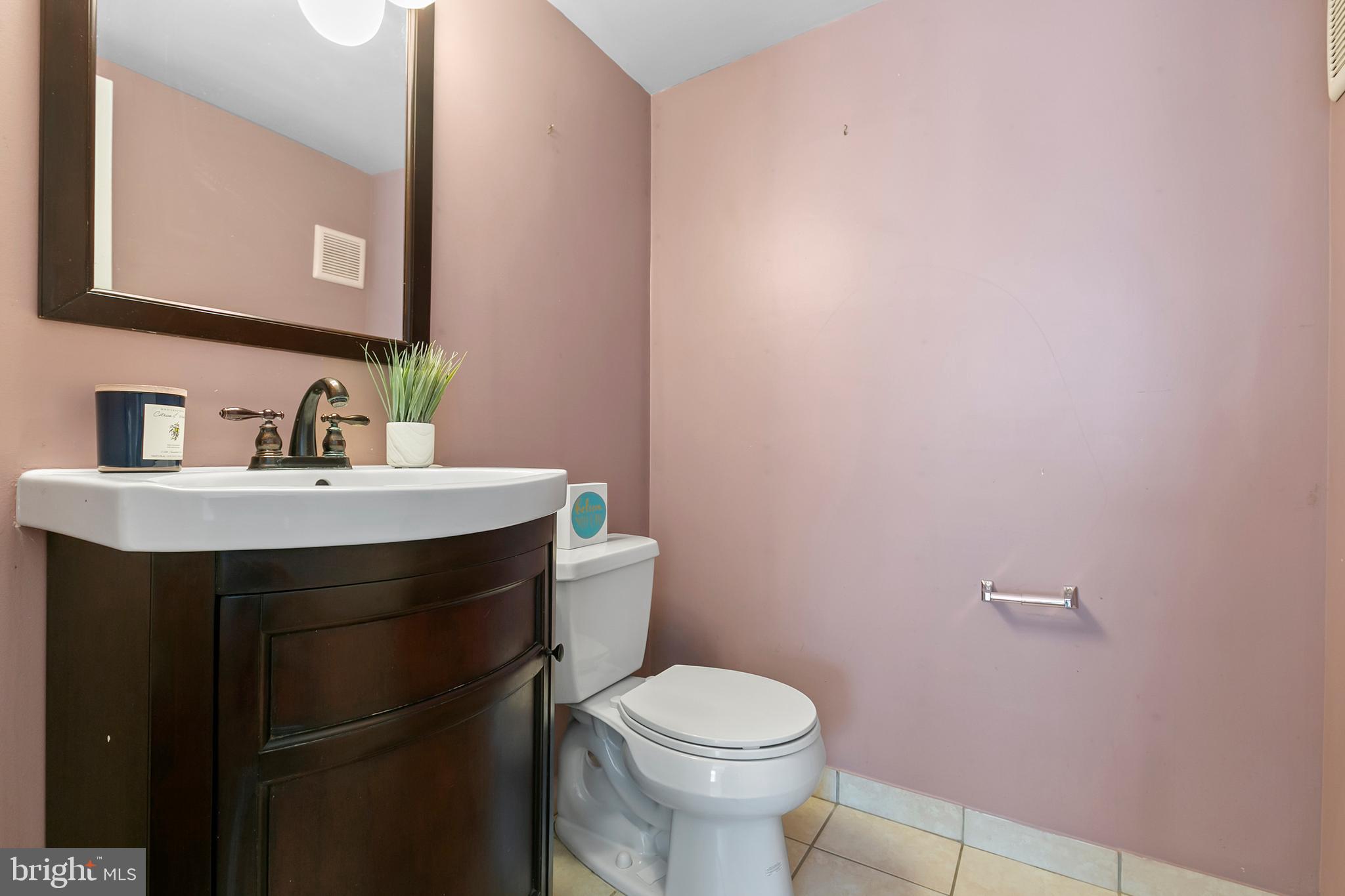 523 Estate Road Maple Shade, NJ 08052 - Photo 8 of 30 a bathroom with a sink a toilet and mirror