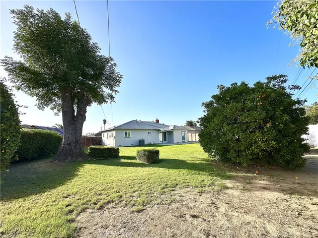 a view of a swimming pool with a yard