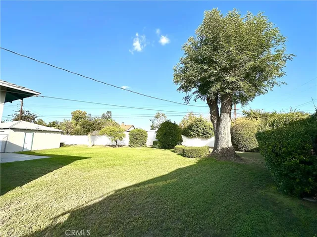 a view of a backyard of the house