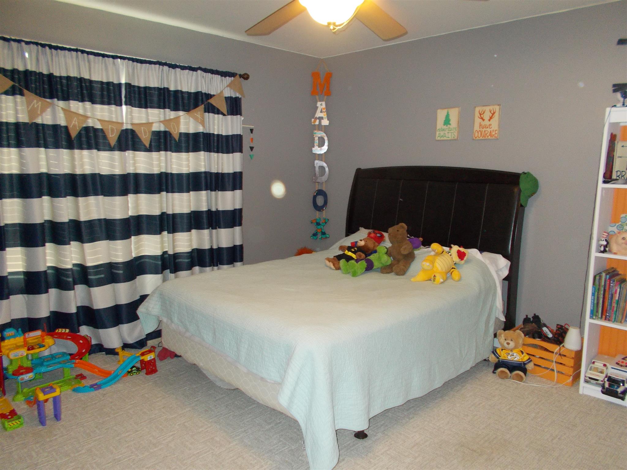 114 Martin Road Lawrenceburg, TN 38464 - Photo 4 of 11 a bedroom with a bed and a dresser