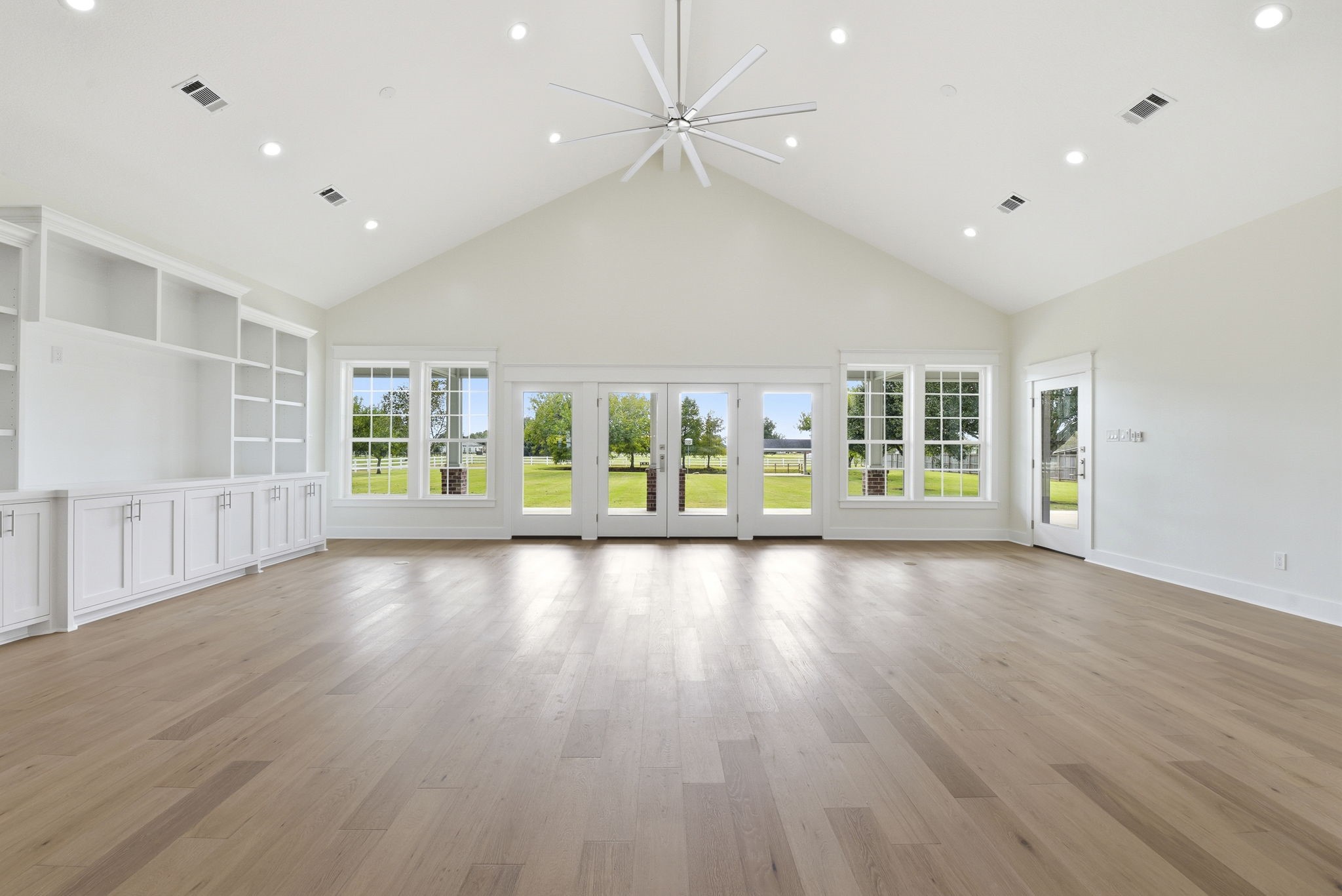 2819 Pearce Meadow Rosharon, TX 77583 - Photo 15 of 50 a view of an empty room with a window and wooden floor