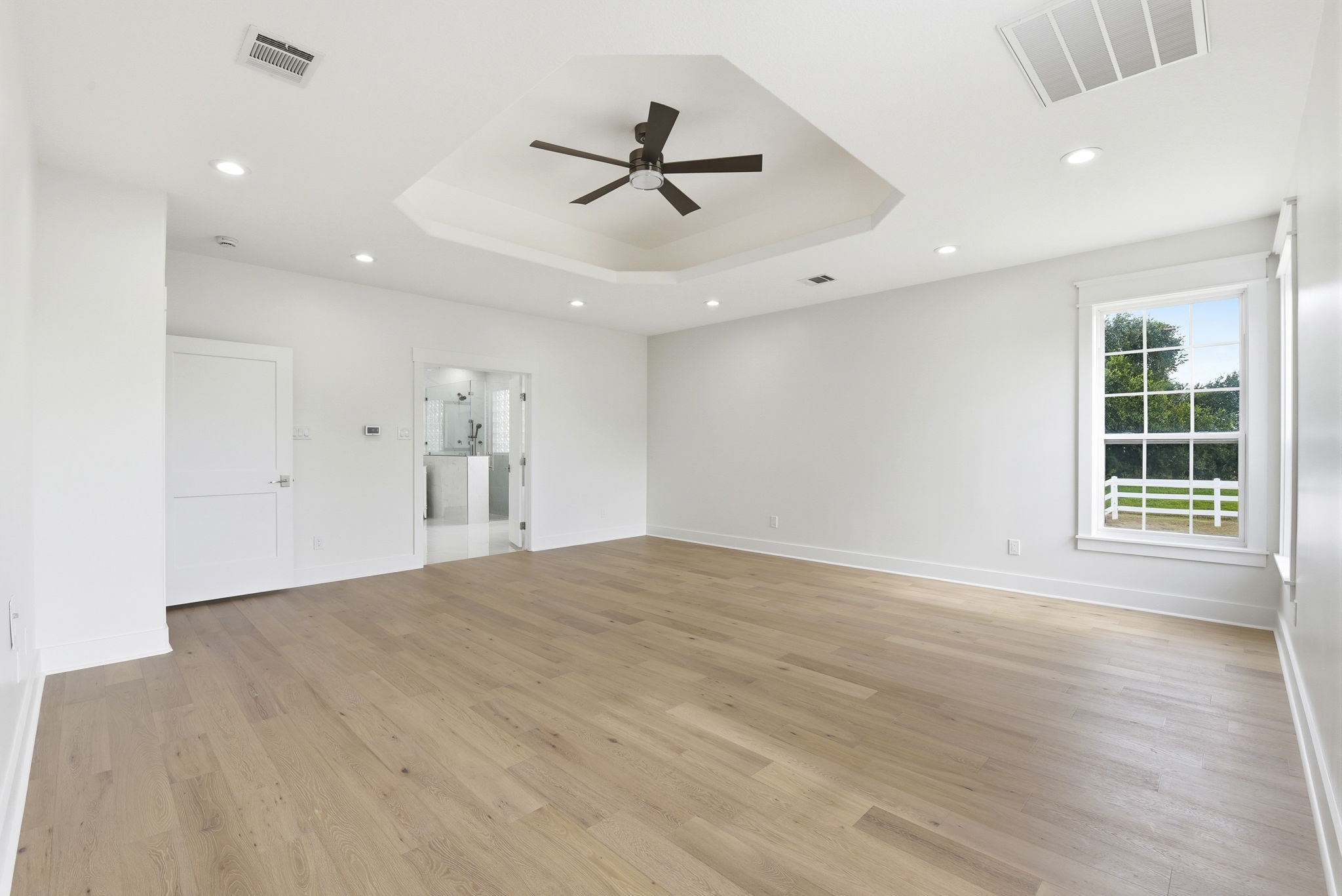 2819 Pearce Meadow Rosharon, TX 77583 - Photo 24 of 50 a view of empty room with wooden floor and fan