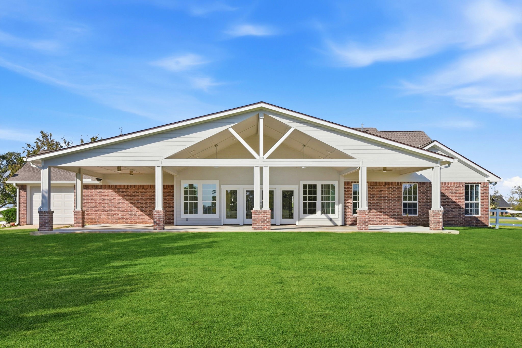 2819 Pearce Meadow Rosharon, TX 77583 - Photo 33 of 50 a front view of a house with a garden and trees