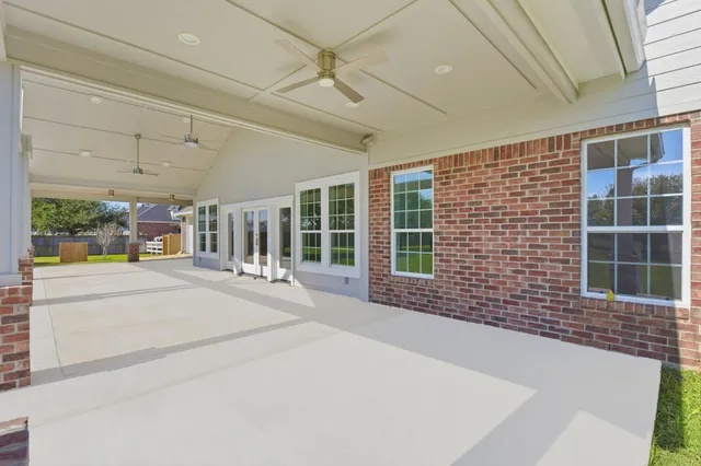 a spacious bathroom with a tub and garden view