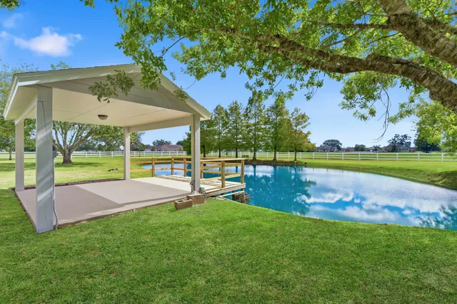 a view of a lake with houses in the back