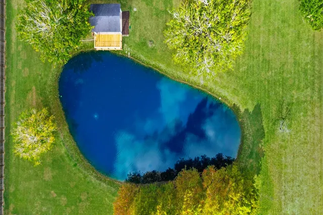 a view of a lake with a yard