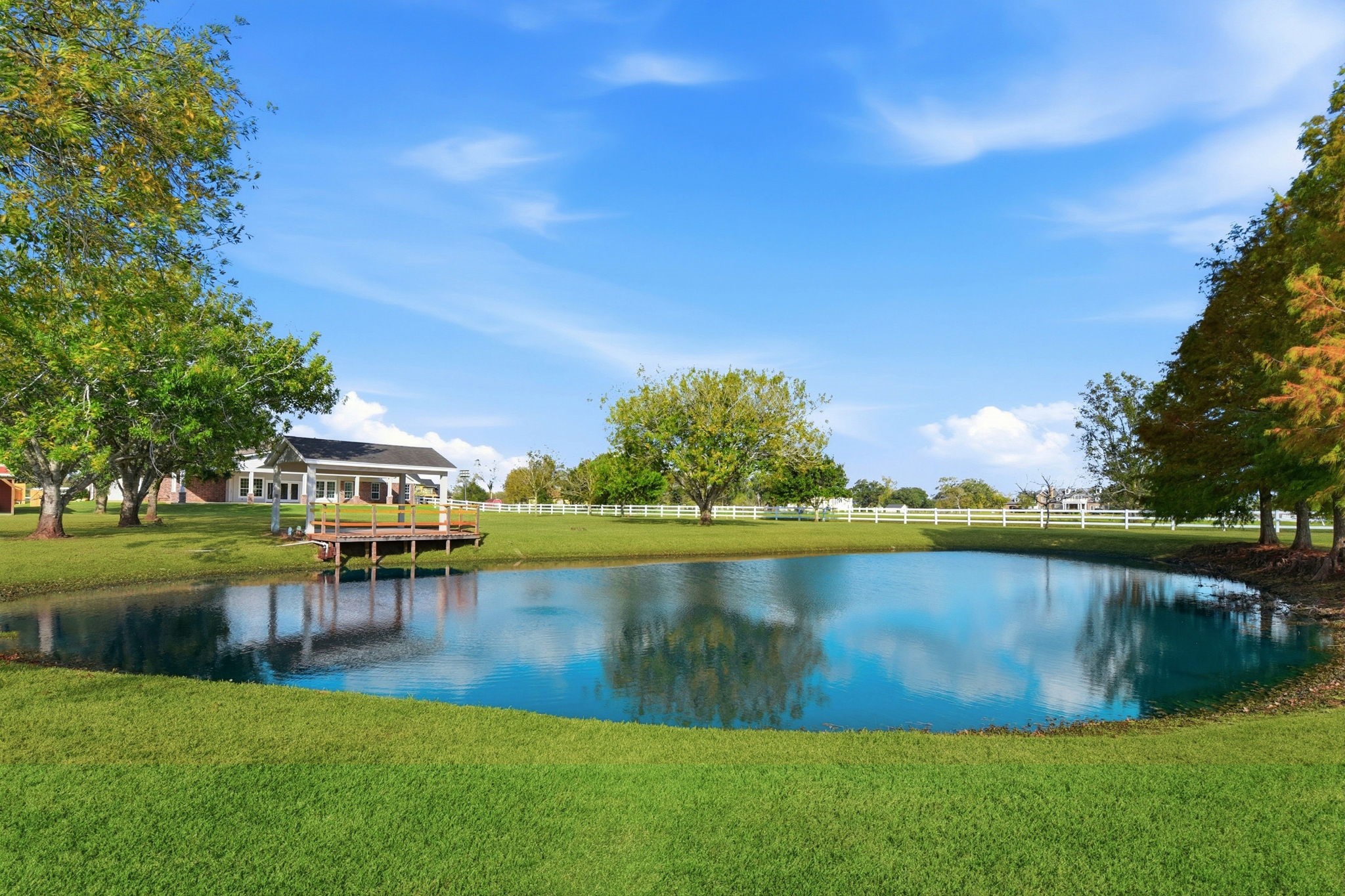 2819 Pearce Meadow Rosharon, TX 77583 - Photo 42 of 50 a view of a lake with houses in the back