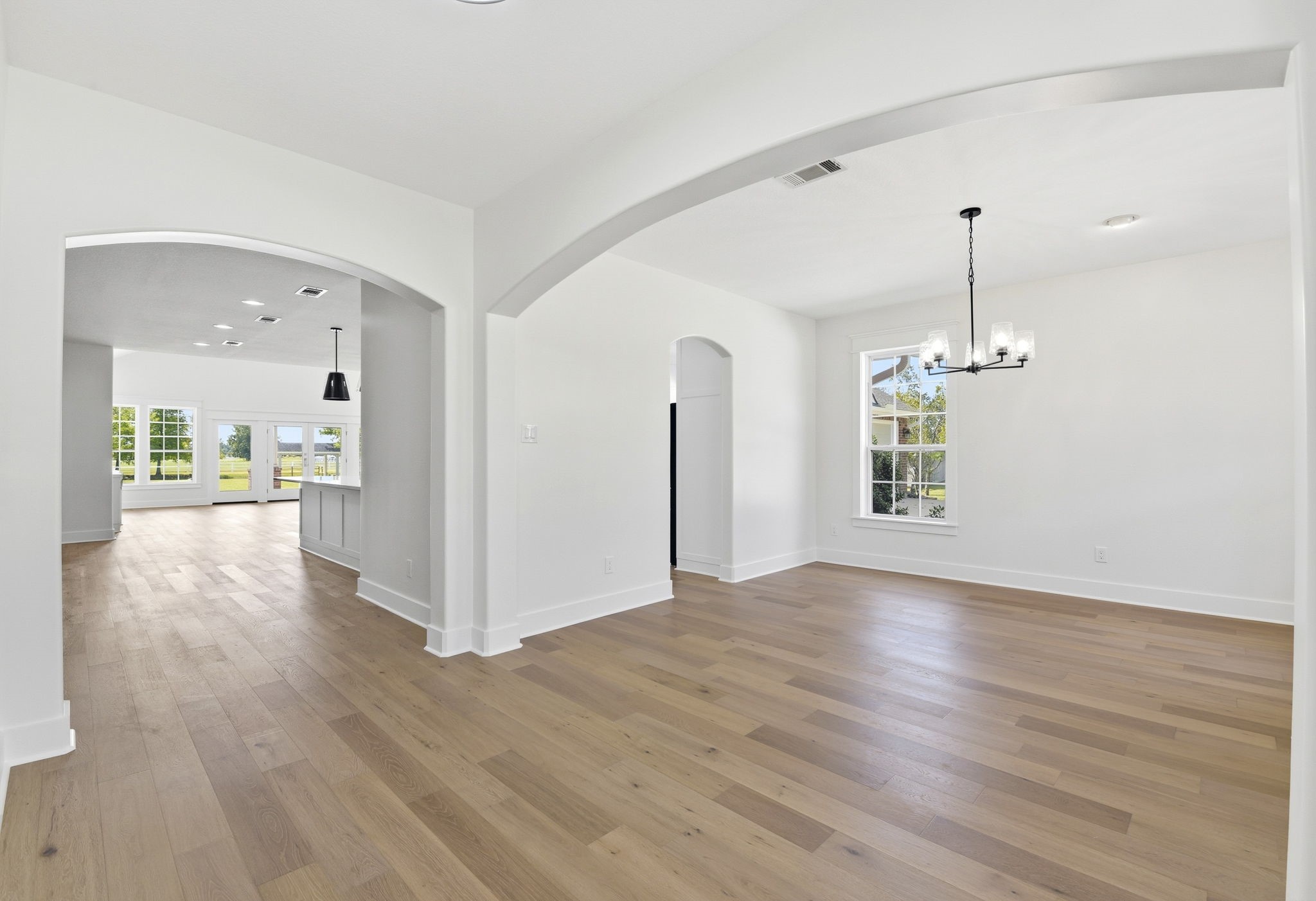 2819 Pearce Meadow Rosharon, TX 77583 - Photo 7 of 50 a view of a room with wooden floor and a window