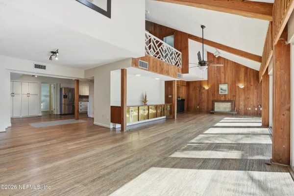 a view of an entryway with wooden floor
