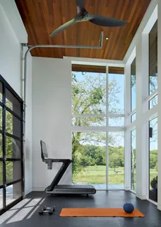 a view of a hallway with wooden shelves
