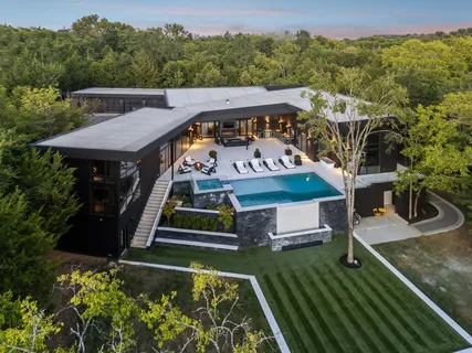 an aerial view of a house with a garden