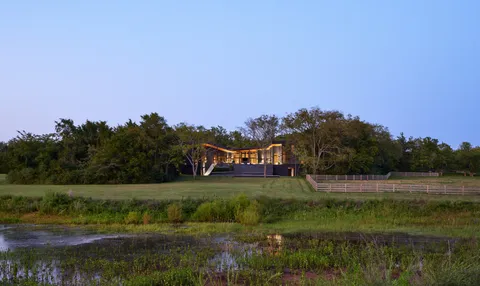 a view of a house with backyard sitting area and garden