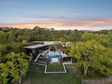 a view of swimming pool with a patio