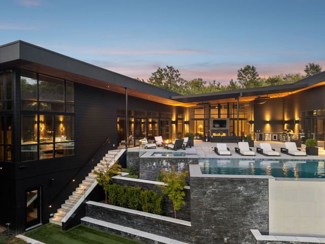 a view of house with trees in front of it