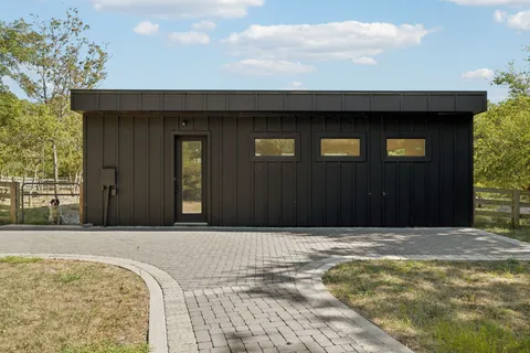 a view of a yard with swimming pool