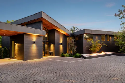 a view of a house with basketball court