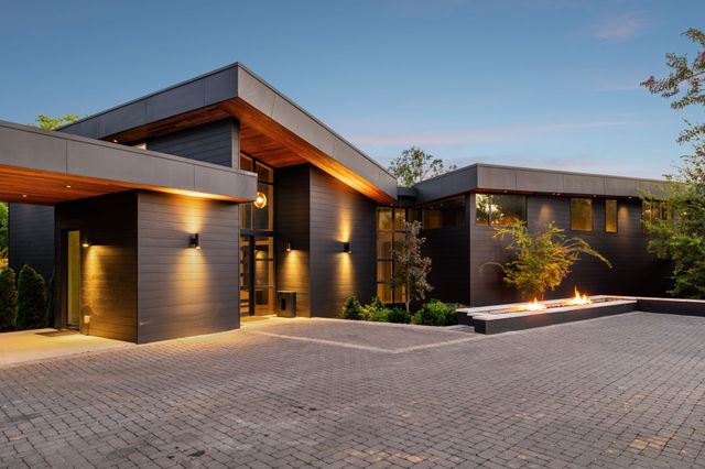 a view of a house with basketball court