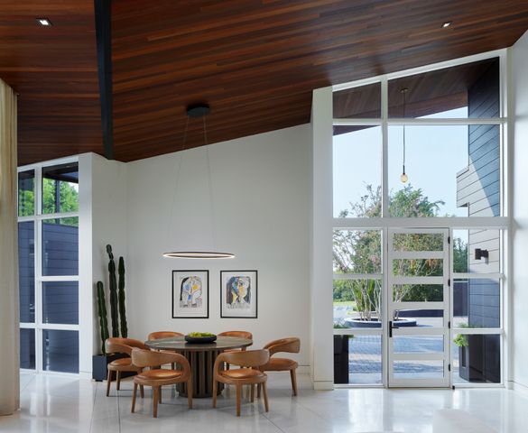 a living room with furniture window and wooden floor