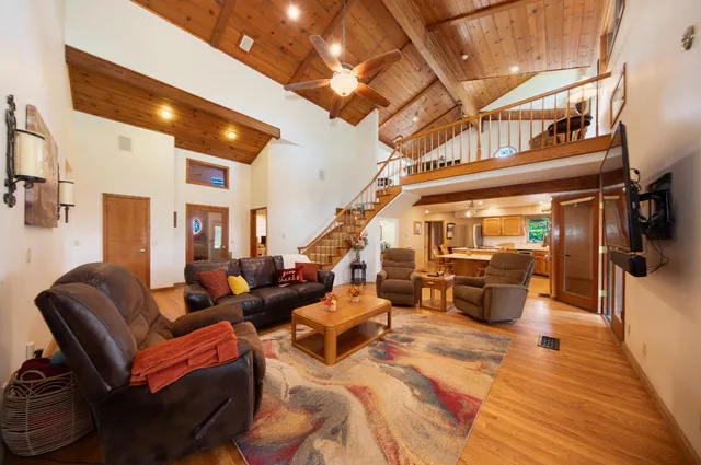 a large kitchen with a table and chairs