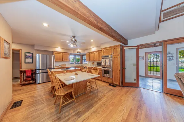 a view of a dining room with furniture window and outside view