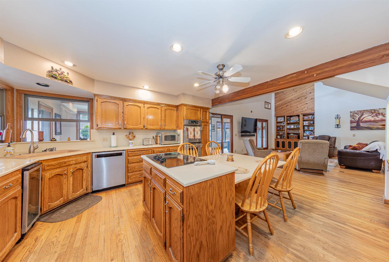 4449 Stetson Road Clovis, CA 93619 - Photo 20 of 93 a large kitchen with a table and chairs