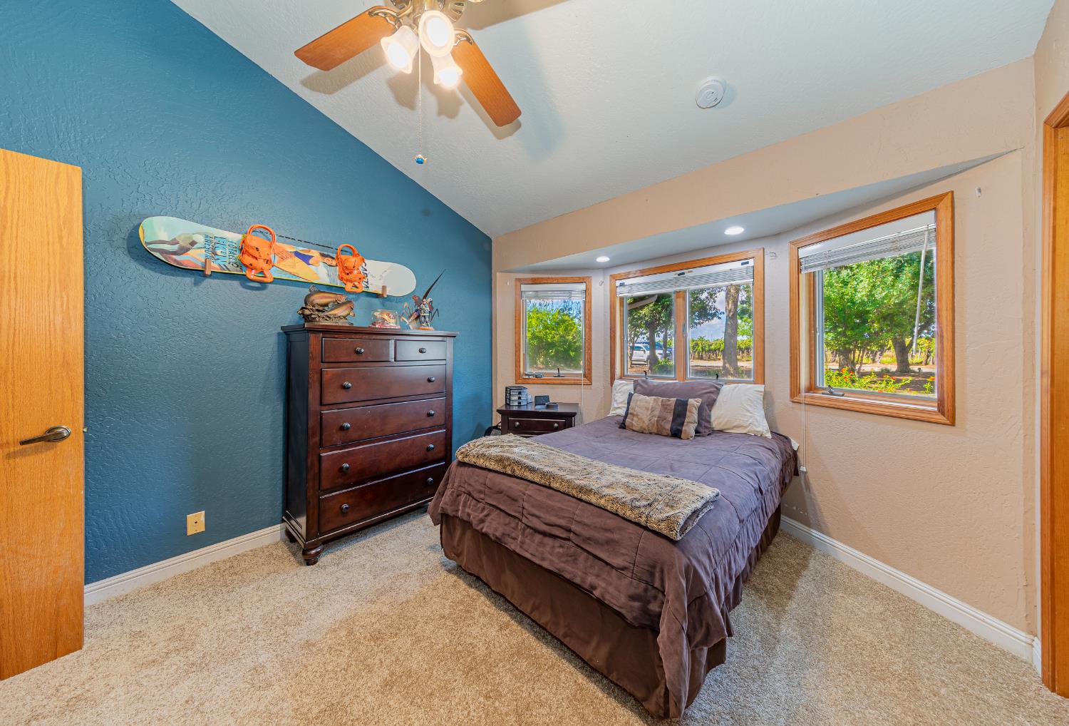 4449 Stetson Road Clovis, CA 93619 - Photo 39 of 93 a bedroom with a bed and a dresser next to a window
