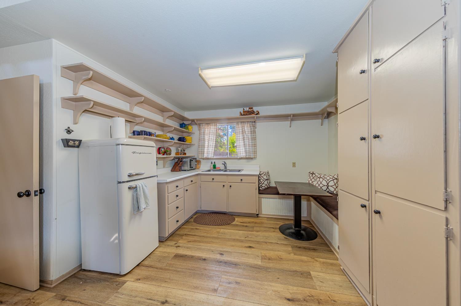 4449 Stetson Road Clovis, CA 93619 - Photo 52 of 93 a kitchen with white cabinets and white appliances