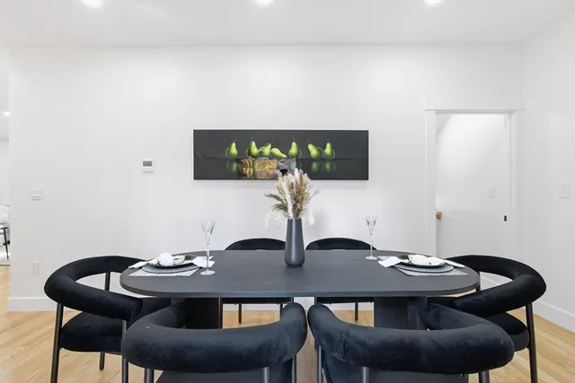 a table and chairs in a blue room