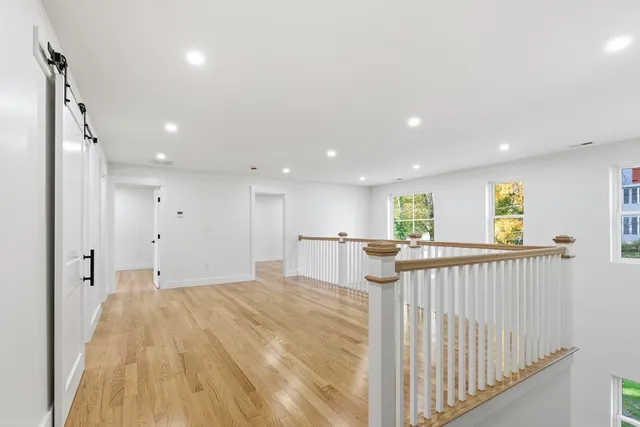 a view of a kitchen with wooden floor