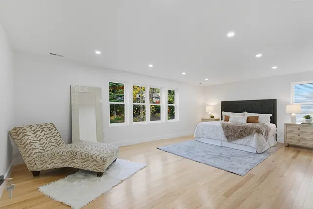 a bedroom with furniture and window