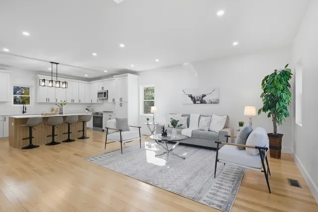 a living room with furniture and a table