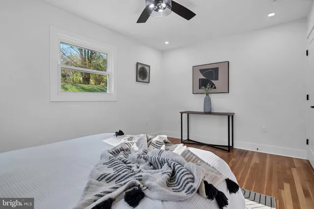 a bedroom with bed and a window