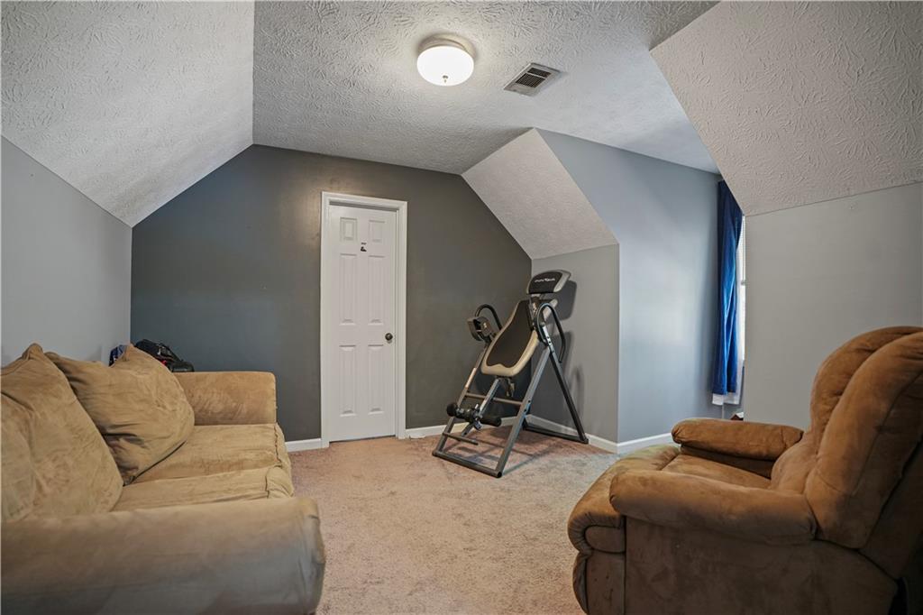 4880 Racquet Court Duluth, GA 30096 - Photo 15 of 22 a view of livingroom with furniture and windows
