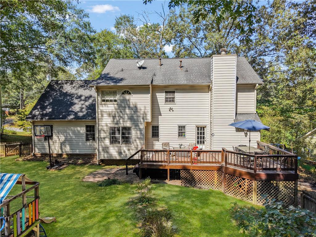 4880 Racquet Court Duluth, GA 30096 - Photo 17 of 22 a view of a house with pool and chairs