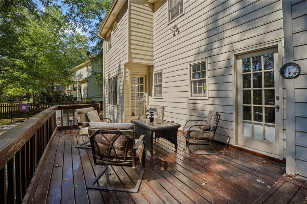 4880 Racquet Court Duluth, GA 30096 - Photo 18 of 22 a balcony view with a seating space