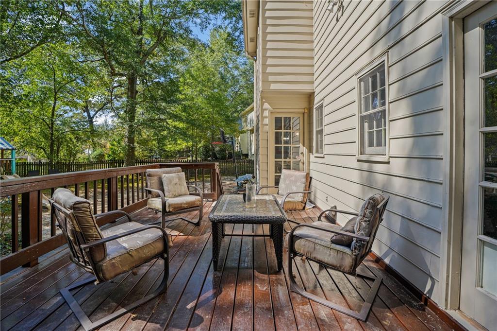 4880 Racquet Court Duluth, GA 30096 - Photo 19 of 22 a view of a patio on wooden deck