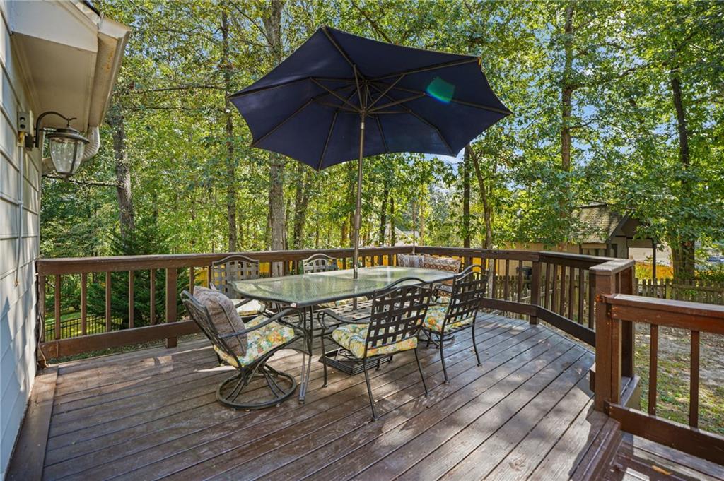 4880 Racquet Court Duluth, GA 30096 - Photo 20 of 22 a view of balcony with furniture and wooden floor