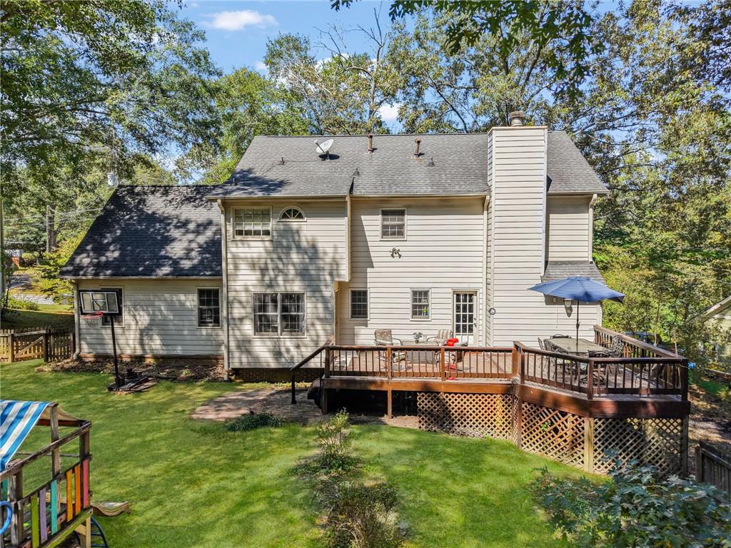 4880 Racquet Court Duluth, GA 30096 - Photo 22 of 22 a view of a house with pool and chairs